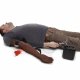Trenažér kontroly krvácení dolní končetiny, tmavá pleť